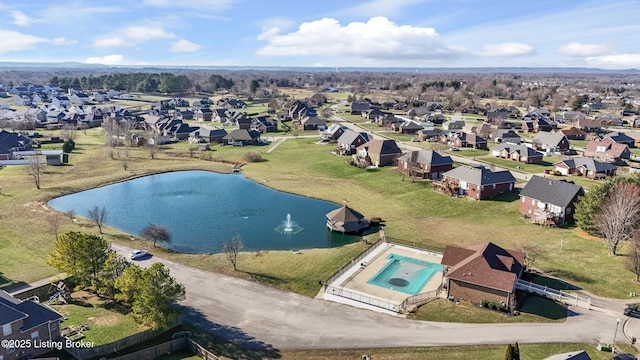 drone / aerial view featuring a residential view and a water view