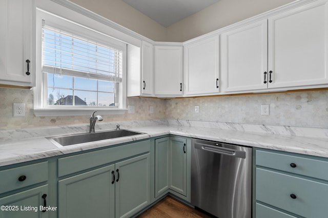 kitchen featuring white cabinetry, green cabinetry, a sink, decorative backsplash, and dishwasher