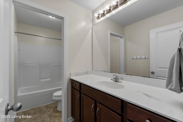 bathroom with toilet, bathtub / shower combination, and vanity