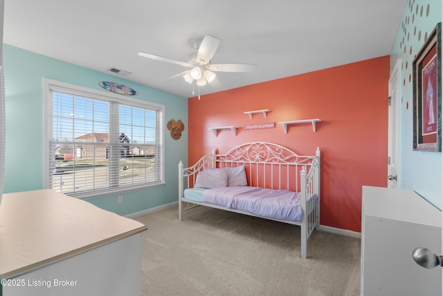 bedroom featuring visible vents, baseboards, and carpet