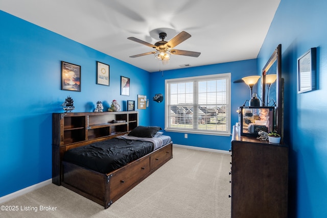 bedroom with visible vents, baseboards, a ceiling fan, and carpet flooring