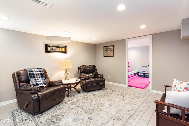 sitting room featuring recessed lighting, visible vents, baseboards, and wood finish floors