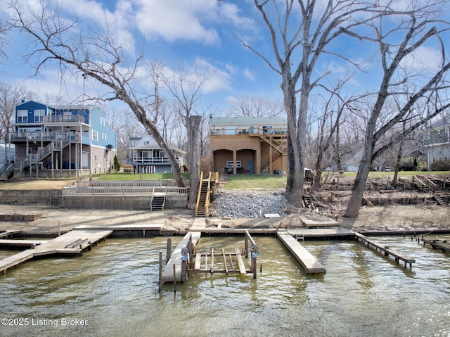 dock area with a water view and stairs