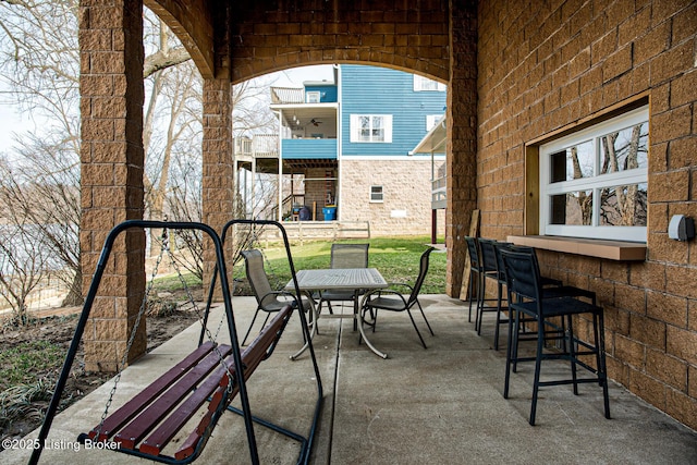 view of patio / terrace featuring outdoor dining area and outdoor dry bar