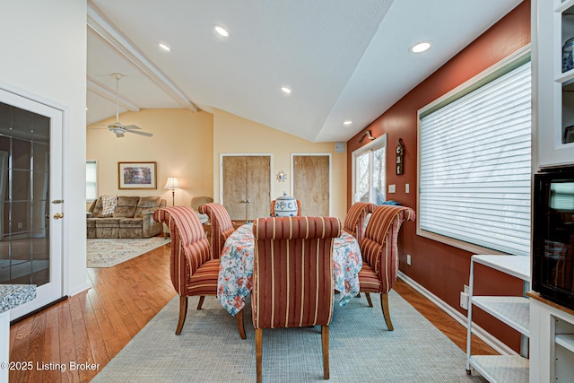 dining space with baseboards, hardwood / wood-style floors, vaulted ceiling, recessed lighting, and a ceiling fan