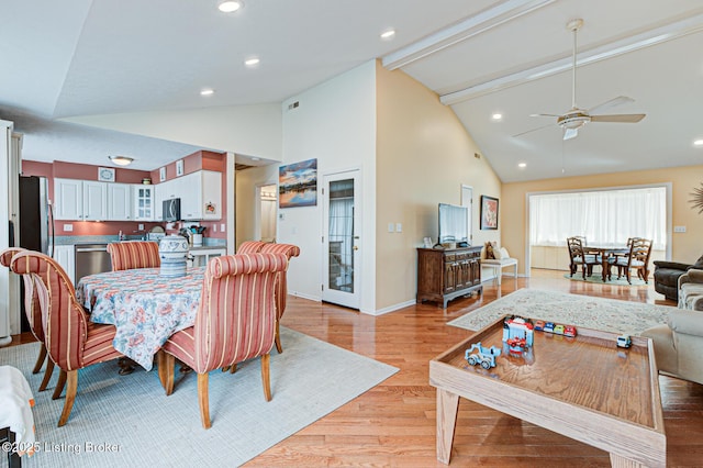 dining room featuring beamed ceiling, light wood-style flooring, a ceiling fan, recessed lighting, and baseboards