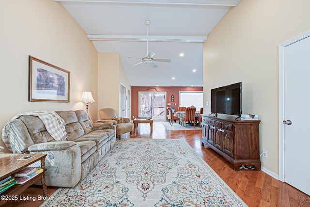 living room with baseboards, ceiling fan, beam ceiling, wood finished floors, and high vaulted ceiling