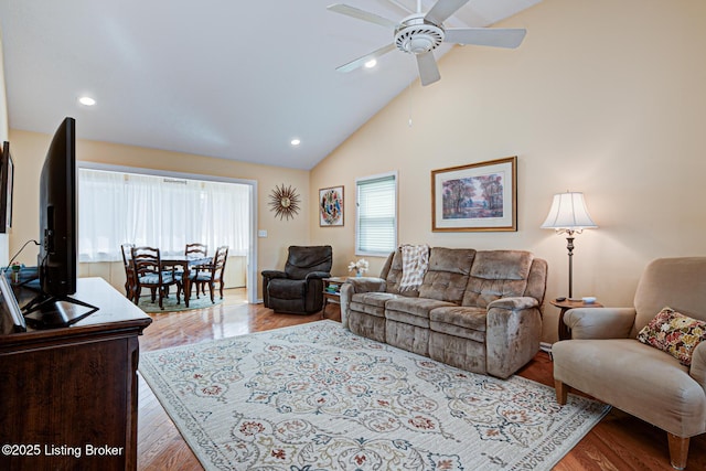 living area featuring recessed lighting, high vaulted ceiling, ceiling fan, and wood finished floors