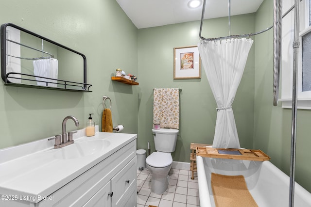 bathroom with baseboards, toilet, a shower with shower curtain, tile patterned floors, and vanity