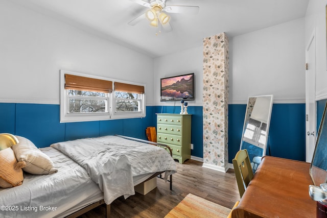 bedroom featuring ceiling fan and wood finished floors