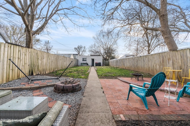 view of patio / terrace with a fenced backyard and an outdoor fire pit