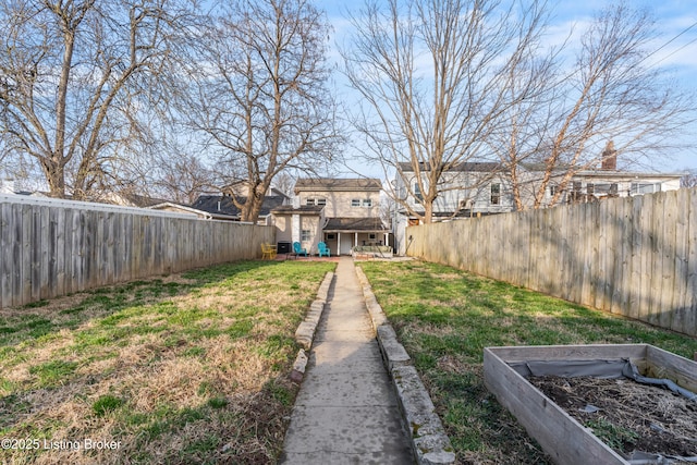 view of yard featuring a fenced backyard