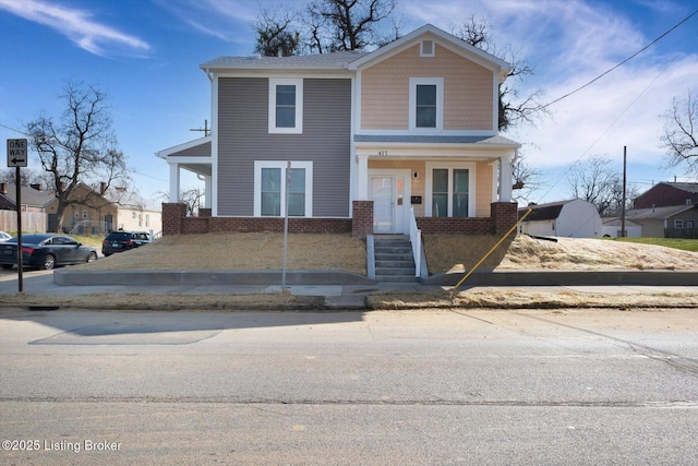 view of front of house with brick siding