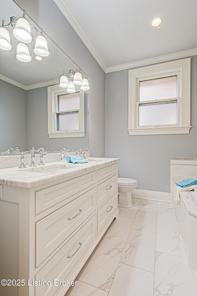 full bathroom featuring toilet, marble finish floor, ornamental molding, baseboards, and vanity