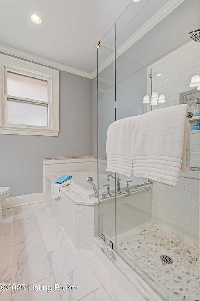 full bathroom featuring a garden tub, marble finish floor, toilet, a shower stall, and crown molding