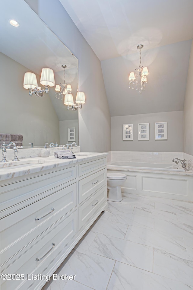 full bathroom featuring vanity, lofted ceiling, marble finish floor, and a chandelier