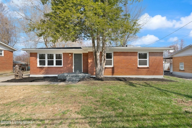 ranch-style house with brick siding and a front lawn