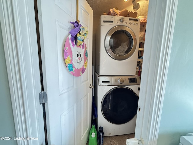 washroom with stacked washer and clothes dryer