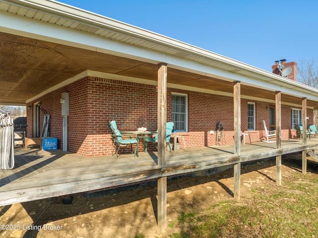 1380 Rice Rd, Lawrenceburg, KY 40342 - rear view of property featuring brick siding, covered porch, and a chimney