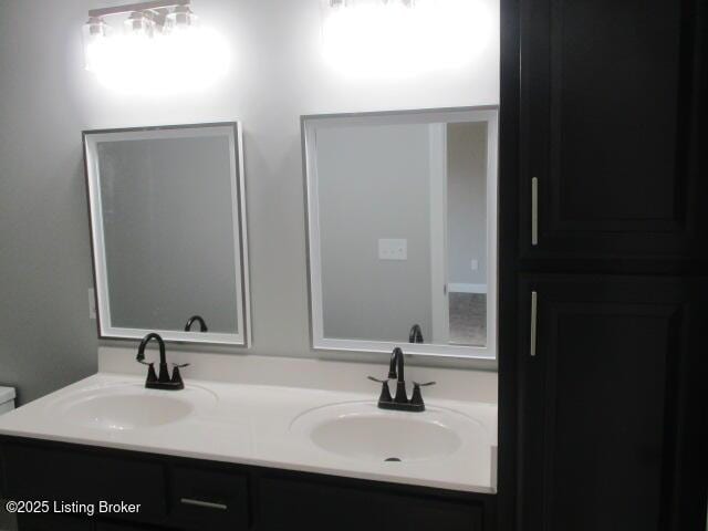 bathroom with double vanity and a sink