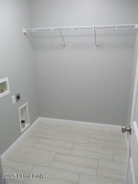 laundry room with laundry area, electric dryer hookup, baseboards, and washer hookup