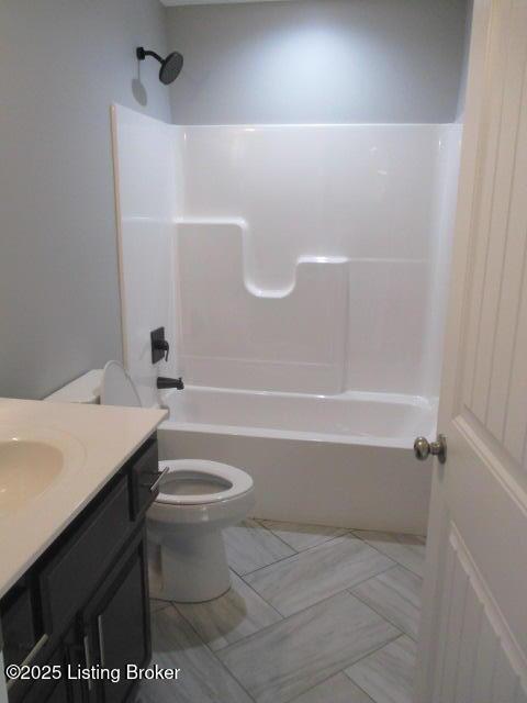 full bath featuring shower / tub combination, toilet, and vanity