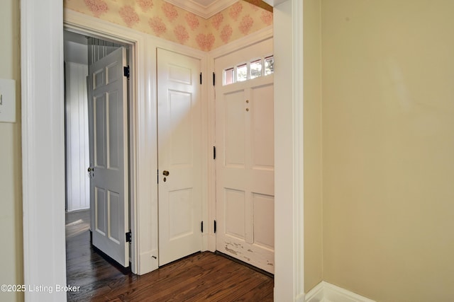 corridor featuring wallpapered walls and dark wood-type flooring