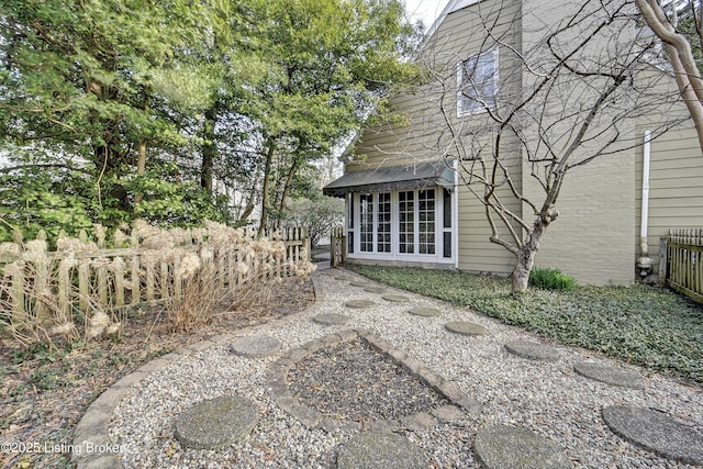 back of house featuring fence