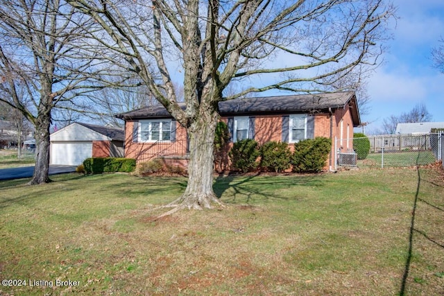 single story home featuring fence, cooling unit, a front yard, a shingled roof, and brick siding