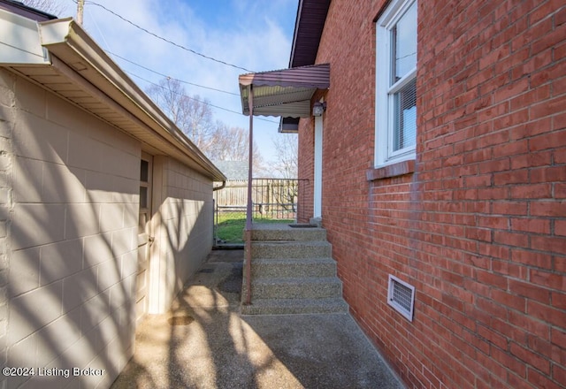 view of side of home featuring brick siding