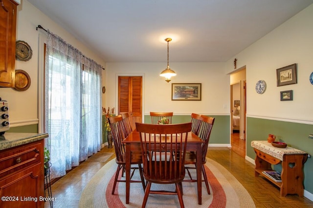 dining area featuring baseboards