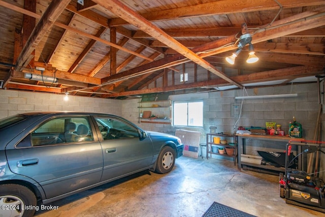 garage with concrete block wall