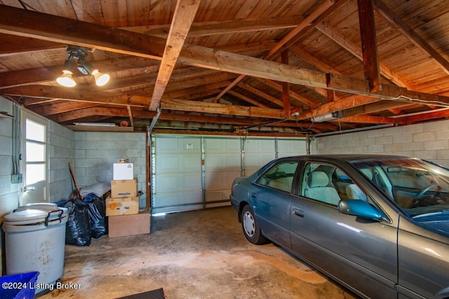 garage with concrete block wall