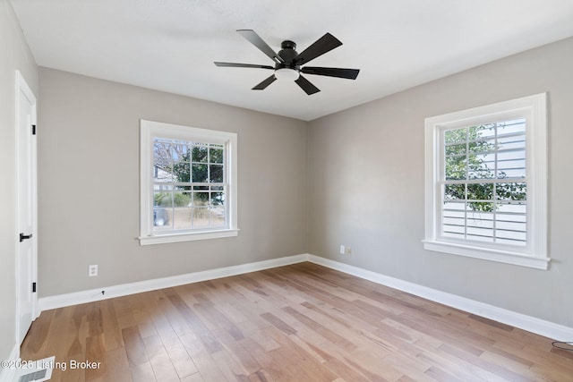 unfurnished room with light wood-type flooring, baseboards, and ceiling fan