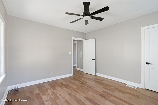 unfurnished bedroom featuring visible vents, light wood-style flooring, baseboards, and ceiling fan