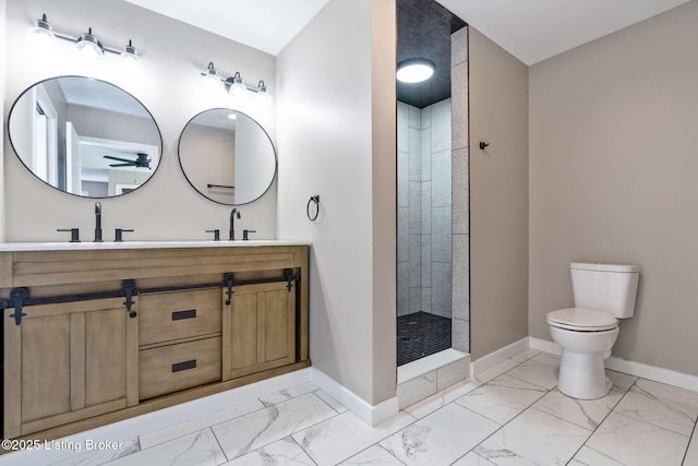 bathroom featuring baseboards, marble finish floor, and a sink