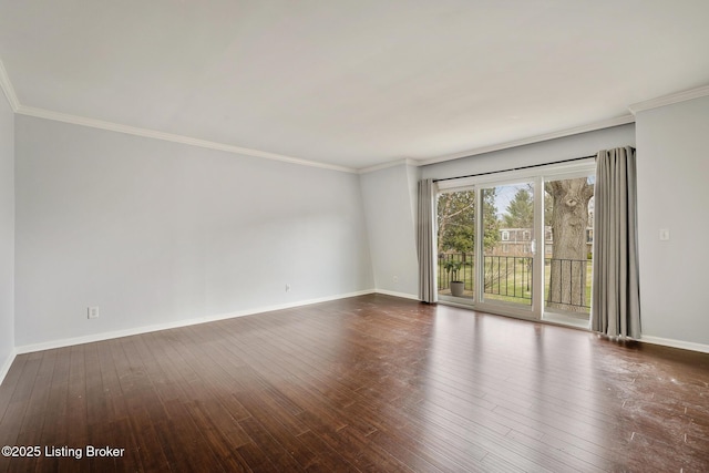 unfurnished room with baseboards and wood finished floors