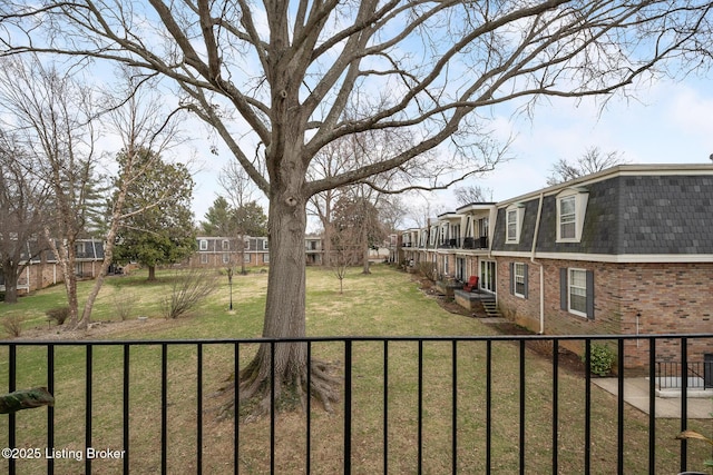 view of yard with a fenced front yard and a residential view