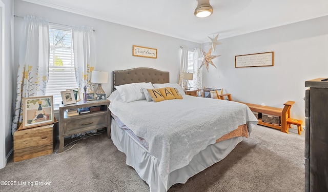 bedroom featuring multiple windows, carpet, and ornamental molding