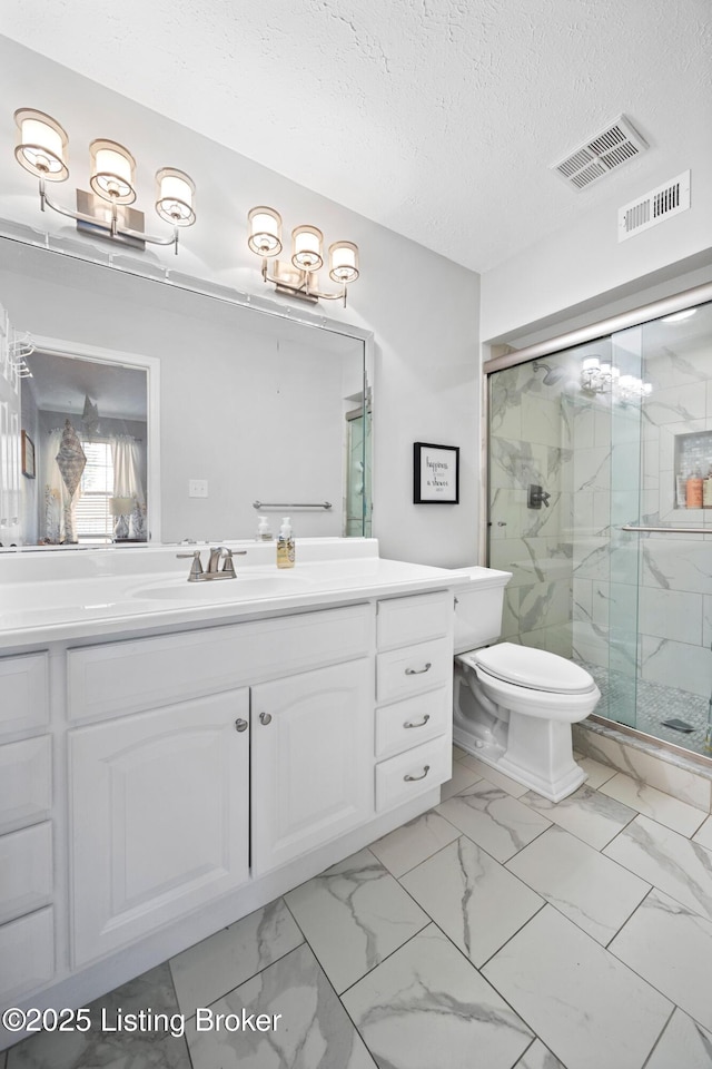 bathroom with a marble finish shower, visible vents, marble finish floor, and toilet