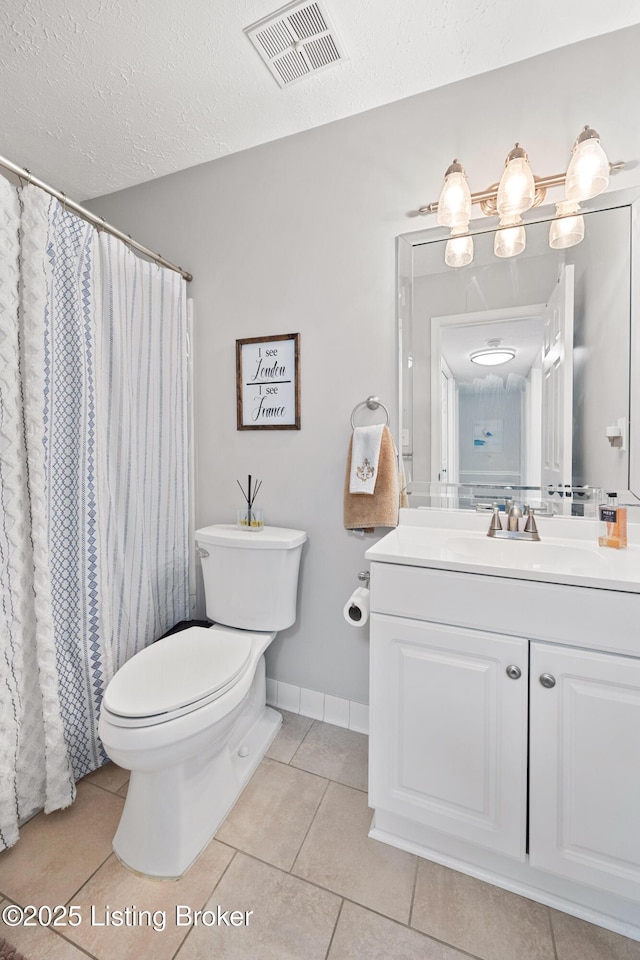 full bath featuring vanity, visible vents, tile patterned flooring, a textured ceiling, and toilet