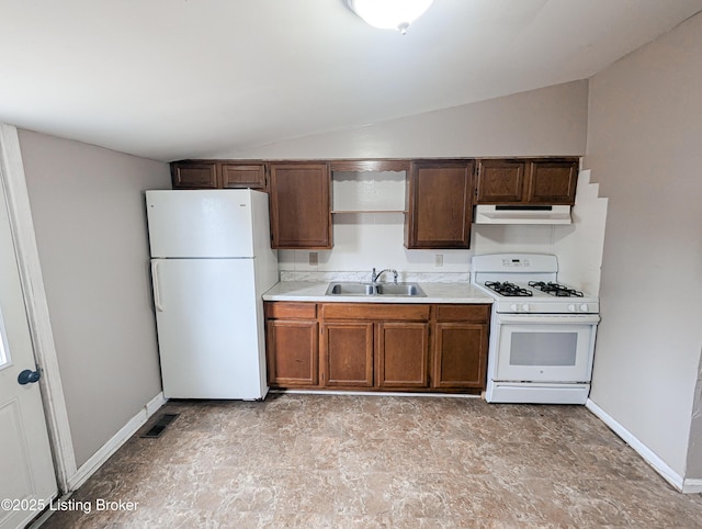 kitchen featuring white appliances, visible vents, lofted ceiling, a sink, and under cabinet range hood