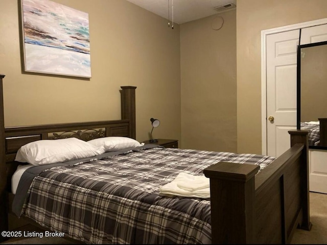 carpeted bedroom with visible vents