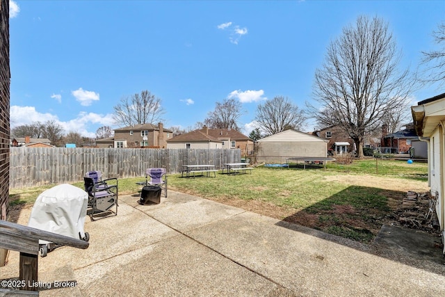 view of patio / terrace with a trampoline and a fenced backyard