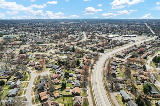 birds eye view of property with a residential view