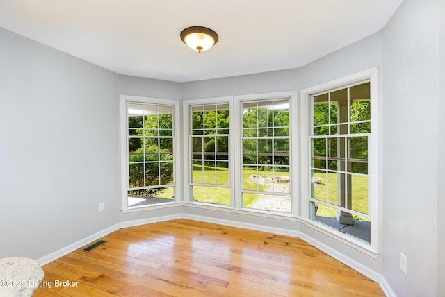 404 Persell Rd, Bedford, KY 40006 - spare room with light wood-type flooring, baseboards, and plenty of natural light