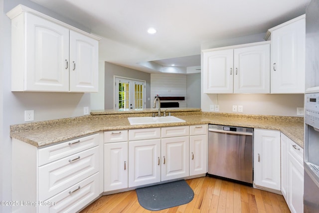 404 Persell Rd, Bedford, KY 40006 - kitchen with dishwasher, a sink, recessed lighting, light wood finished floors, and light countertops