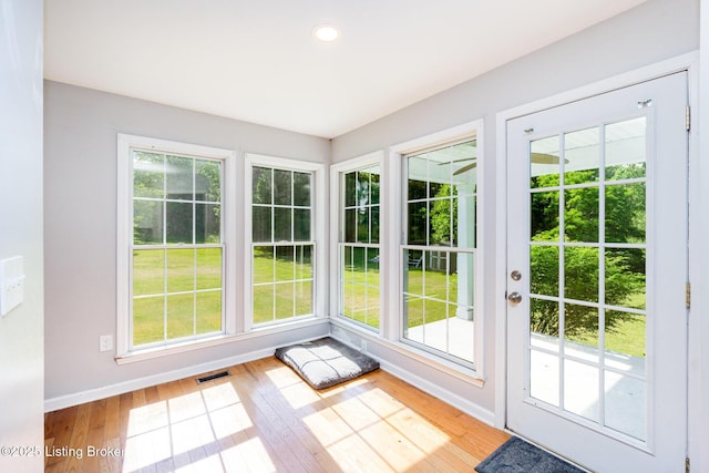 404 Persell Rd, Bedford, KY 40006 - doorway to outside featuring hardwood / wood-style flooring, baseboards, plenty of natural light, and recessed lighting