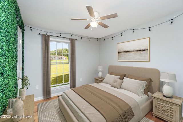 404 Persell Rd, Bedford, KY 40006 - bedroom with light wood finished floors and ceiling fan