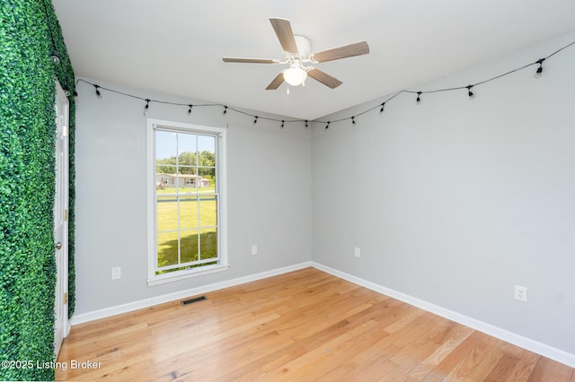404 Persell Rd, Bedford, KY 40006 - spare room featuring light wood-style flooring, a ceiling fan, and baseboards